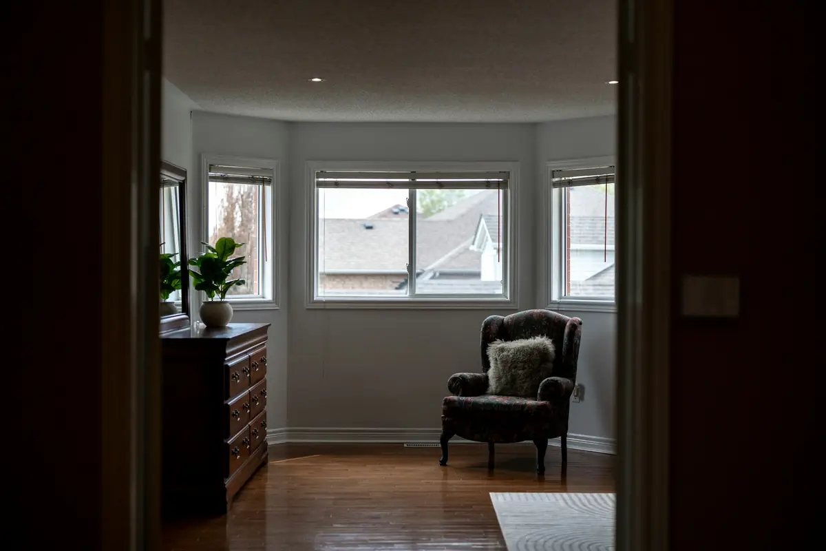 A bright, calm room with an armchair by the window